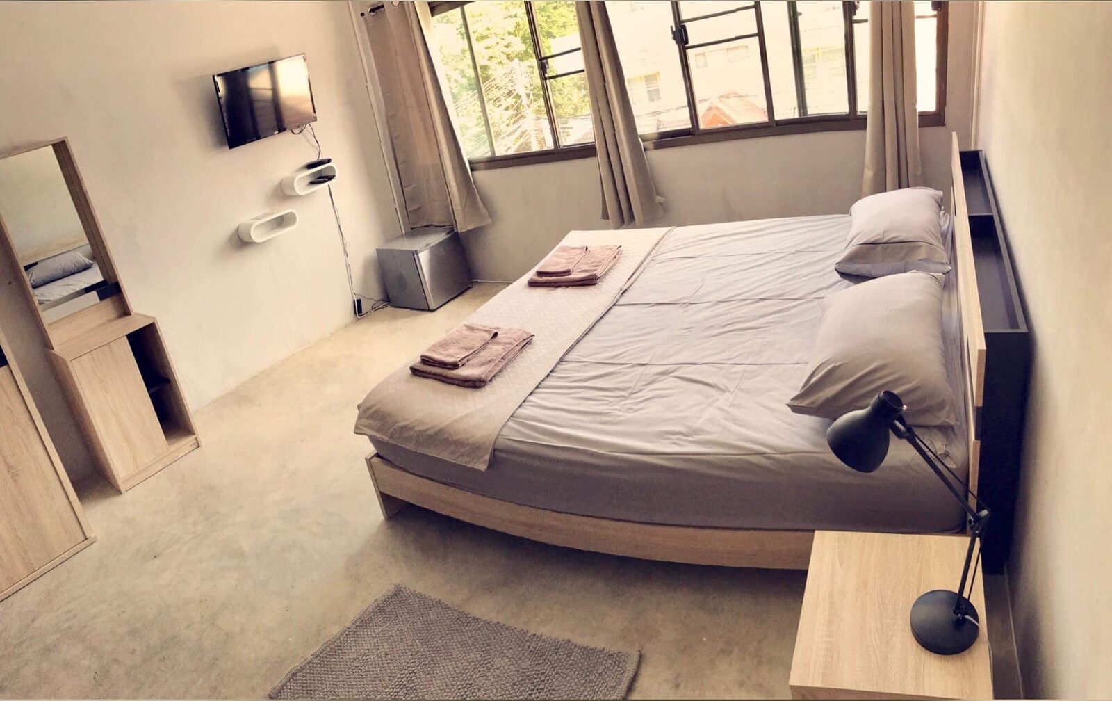 Apartment in Club bedroom with a double bed and window